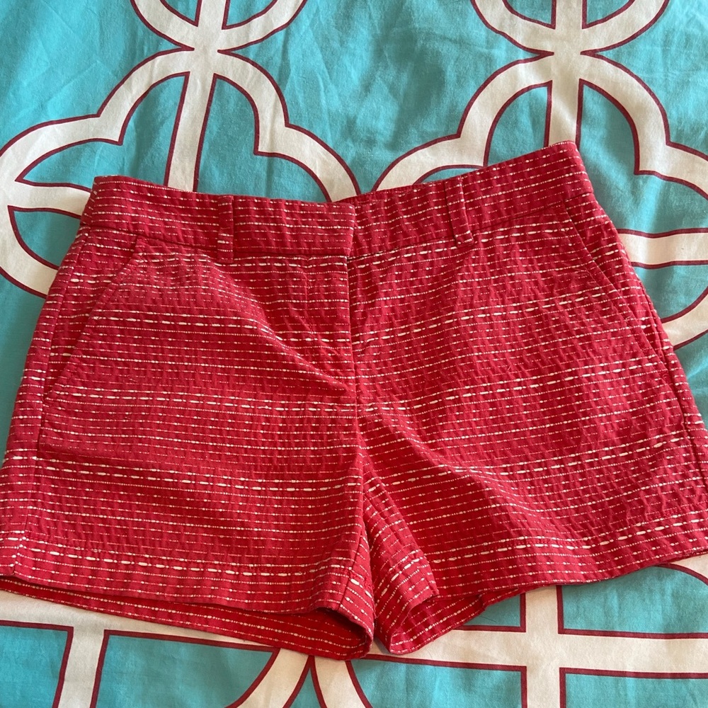 The color is more of a raspberry. They have a great texture! Fun summer short!